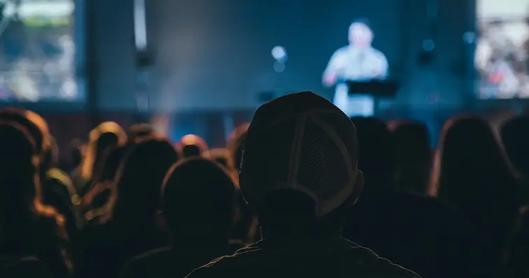 Person giving speech at conference